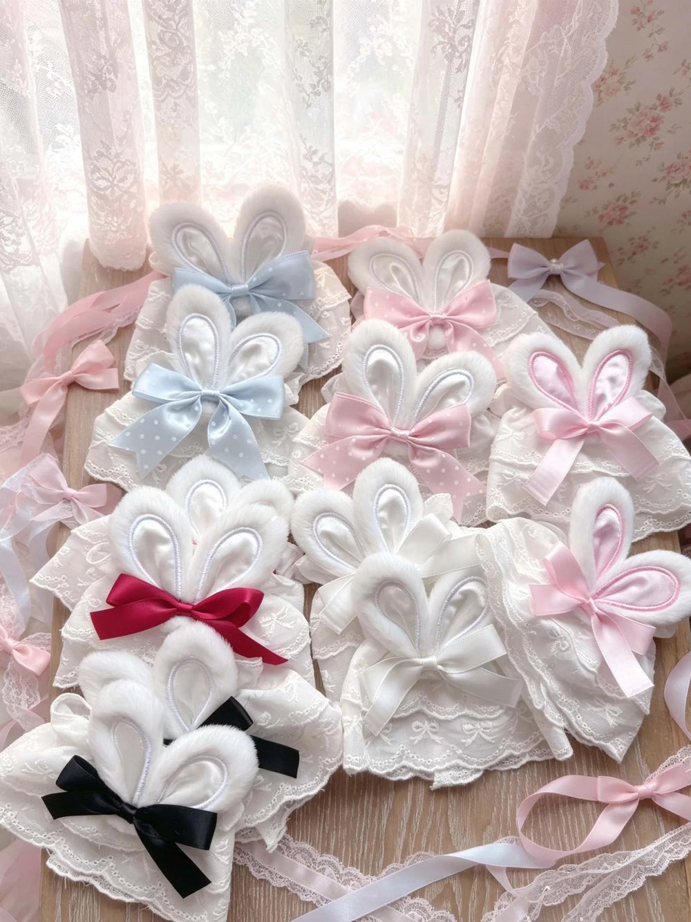 Lace sleeve cuffs with bunny-ear details and ribbon bows shown in white and pink.