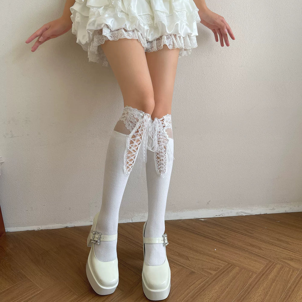 White lace-trim over-the-knee socks with front lacing and long ribbon ties.