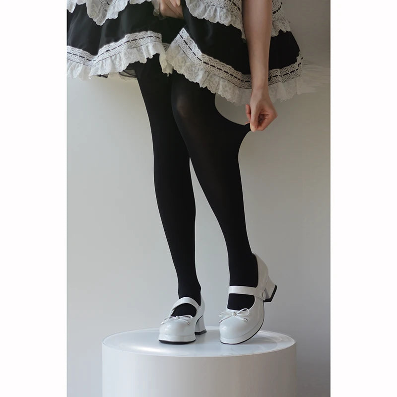 Black and white 80D socks worn in a Japanese uniform-style coordinate.