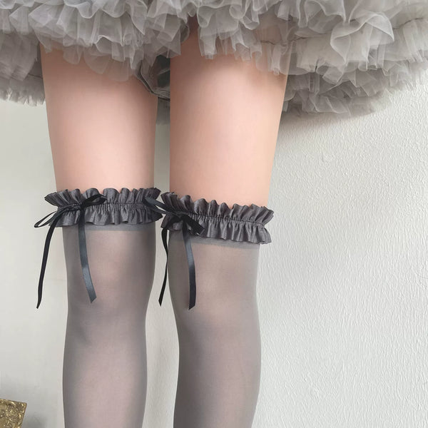 Gray velvet slouch socks with ruffle cuffs and black bows