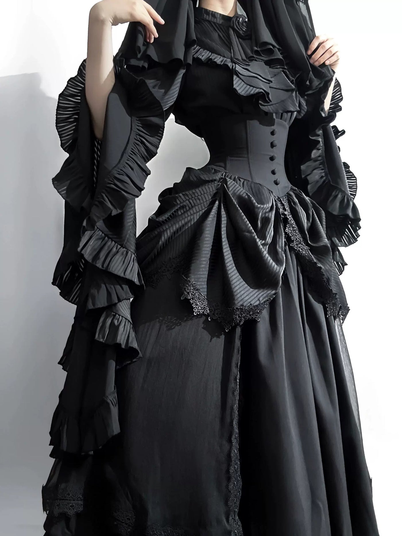 Black hime-sleeve blouse and layered skirt set with draped ruffles