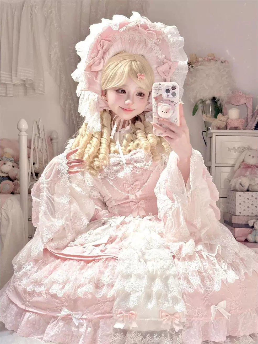 Blush pink Sweet Lolita JSK with tiered lace ruffles and bow accents