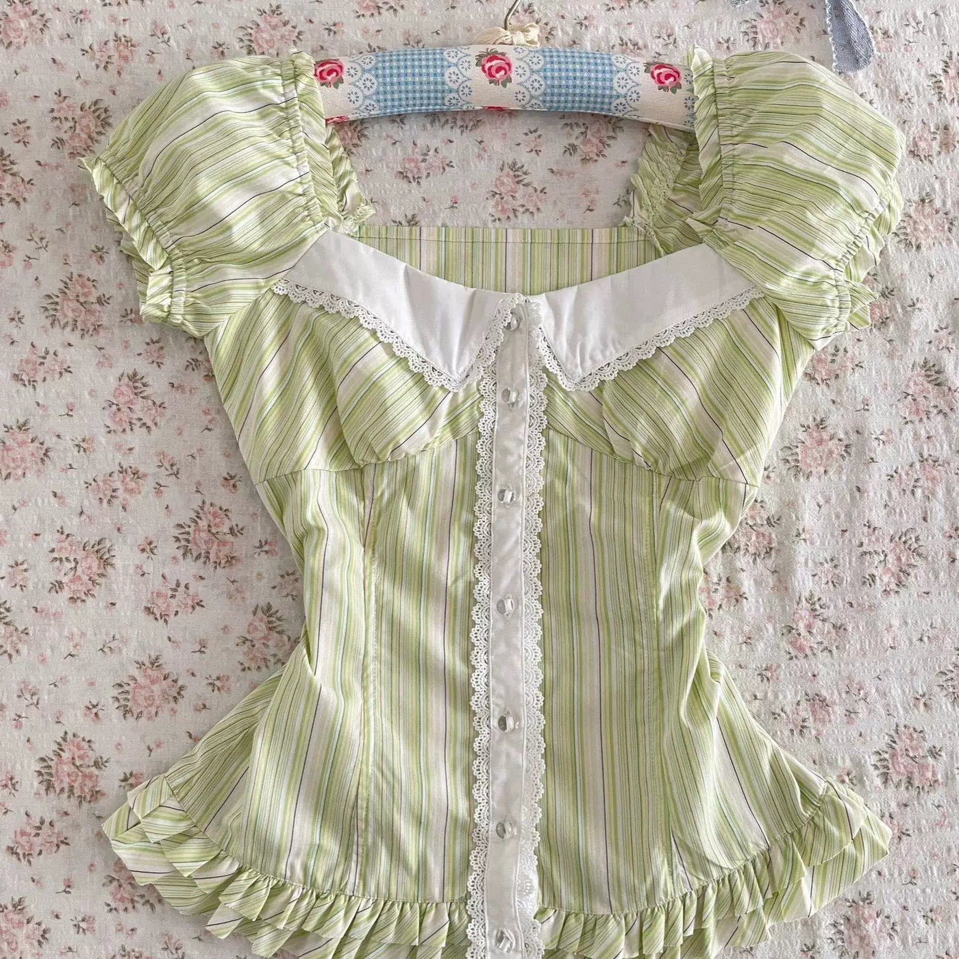 Green striped fitted Lolita top with puff sleeves and a white lace-trimmed collar on a mannequin.