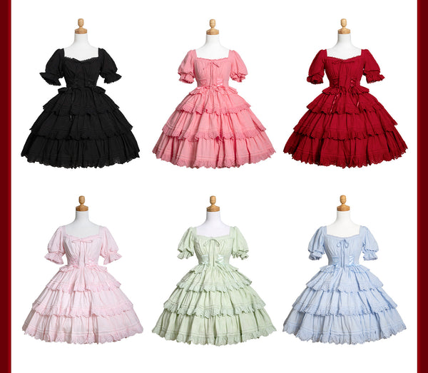Six colourways of a tiered Sweet Lolita dress displayed on mannequins
