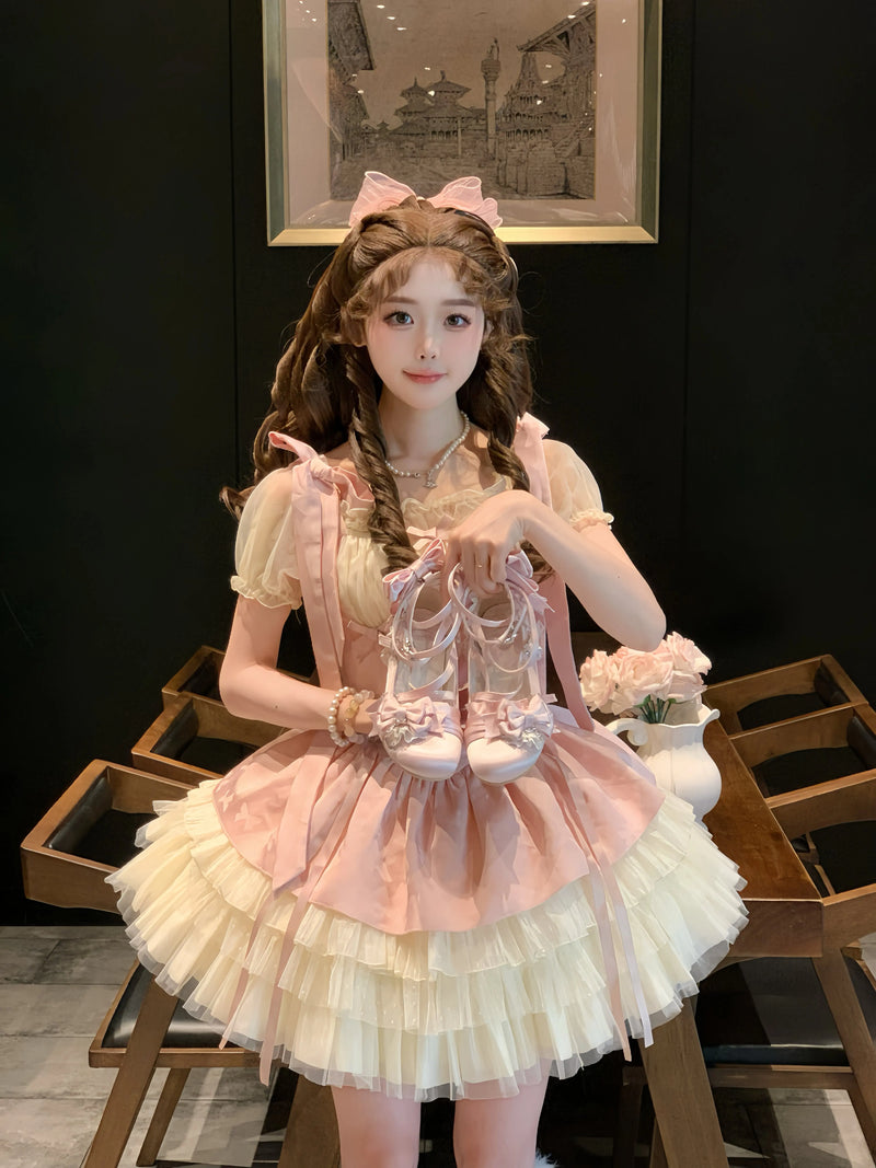 Aimee Thousand Knots Lolita shoes — pink shoes held above a full skirt