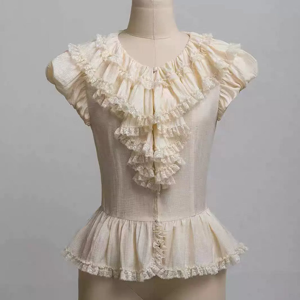 Purple ruffled lace blouse with gathered collar, puff sleeves and layered front flounces
