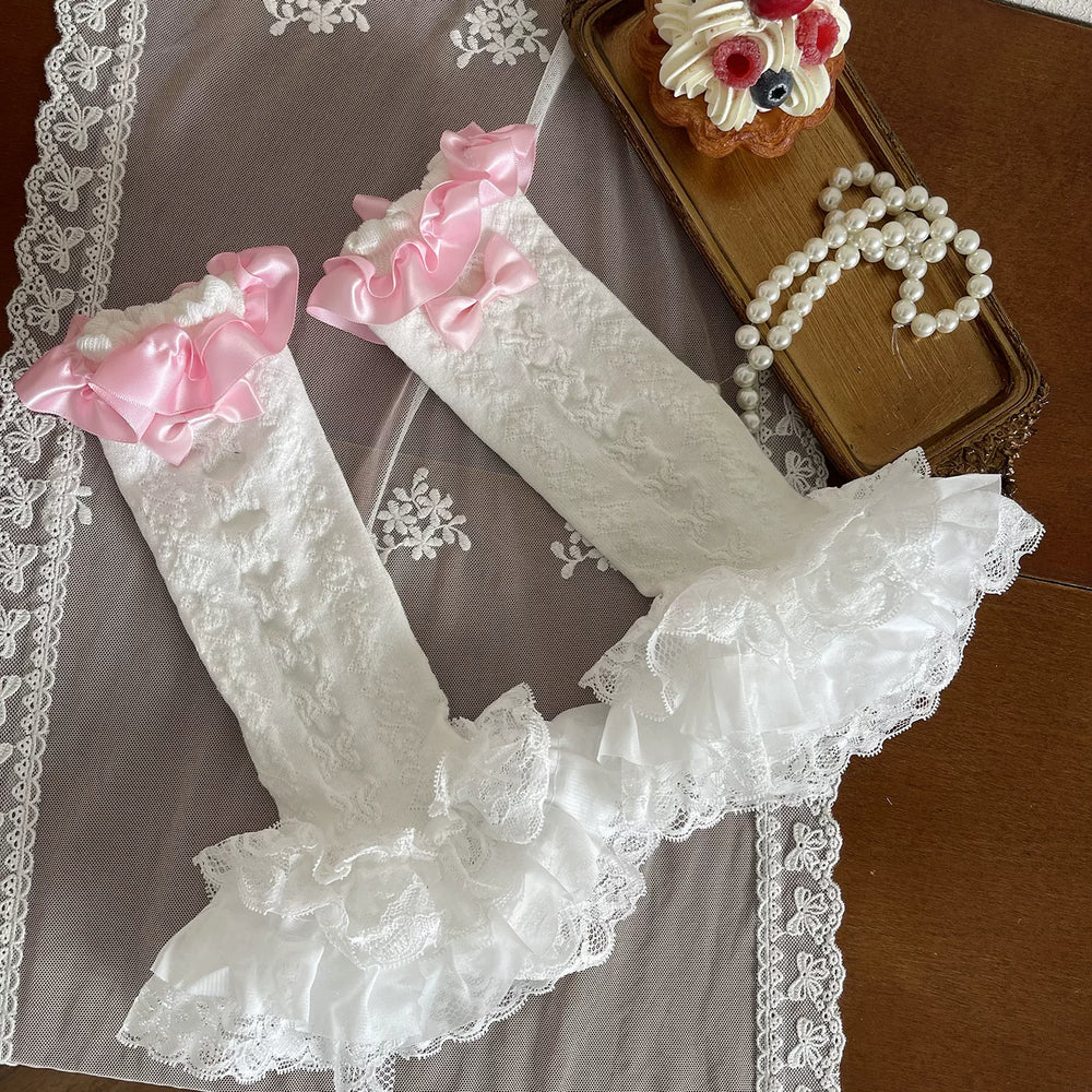 Sock Noble pink lace tights and ruffled sock covers styled with white platform shoes