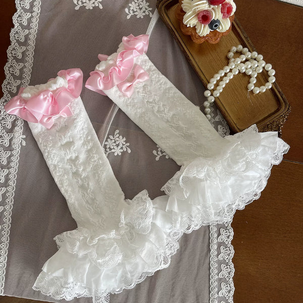 Sock Noble pink lace tights and ruffled sock covers styled with white platform shoes
