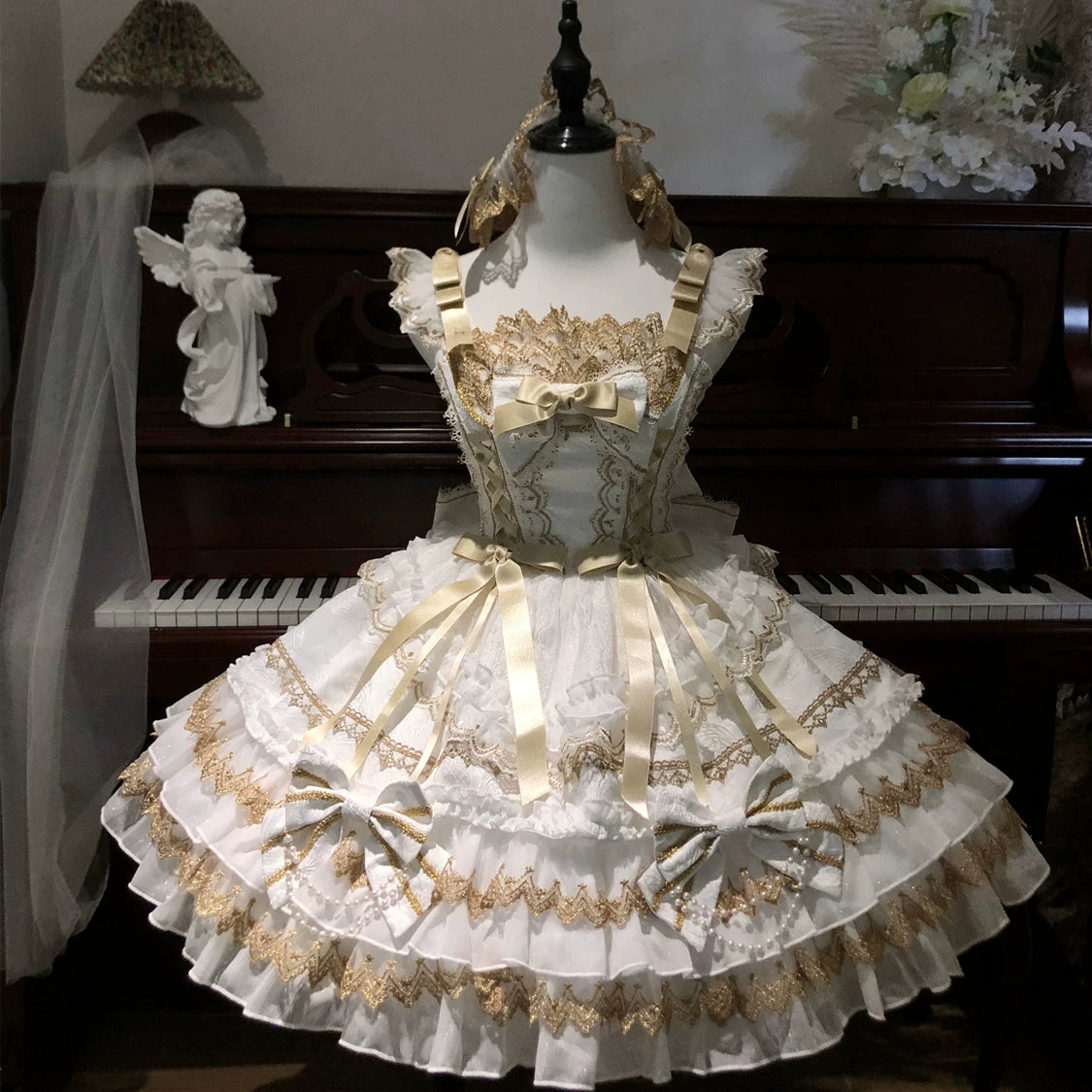 Lady Han Gilt Memory JSK dress by Lolita Fetch featuring elegant gold accents and intricate design details on a stylish dress.