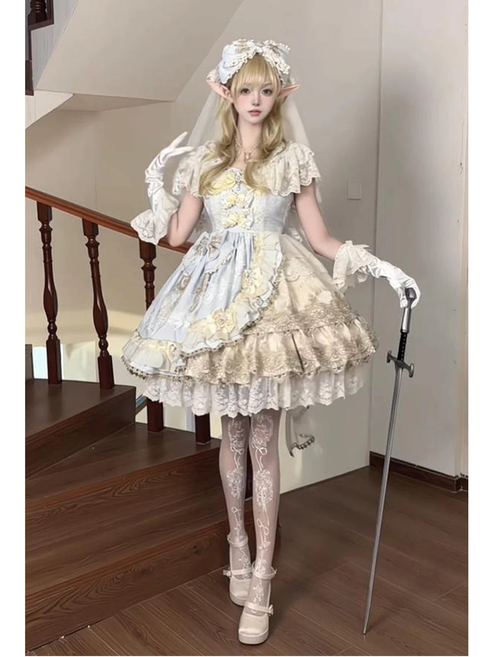 Creamy pale blue and ivory Lolita dress set with lace ruffles, veil, headband, and hand sleeves.
