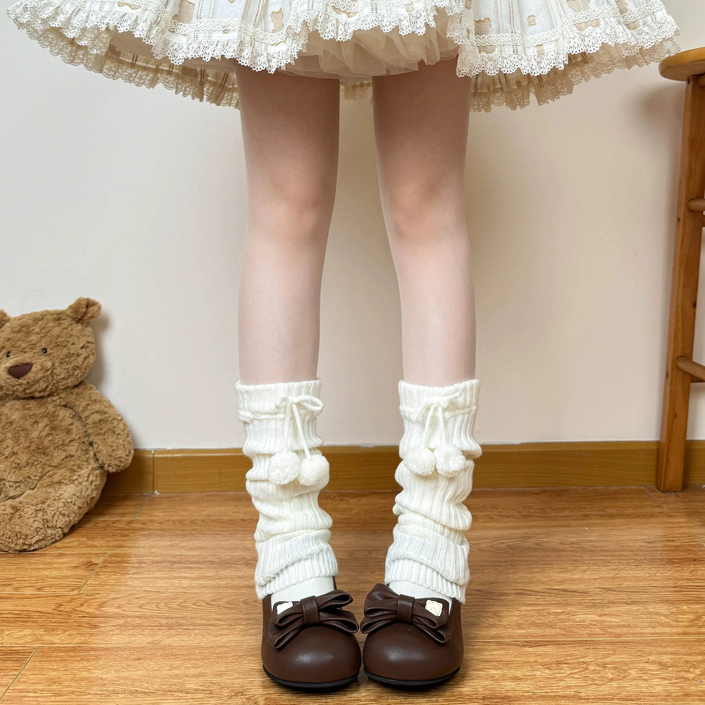 Ivory slouchy ribbed Lolita leg warmer with pom-pom detail