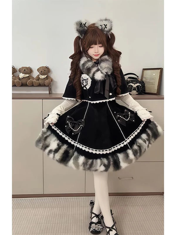 Black winter JSK set styled with a cape, suspender dress, and plush accents
