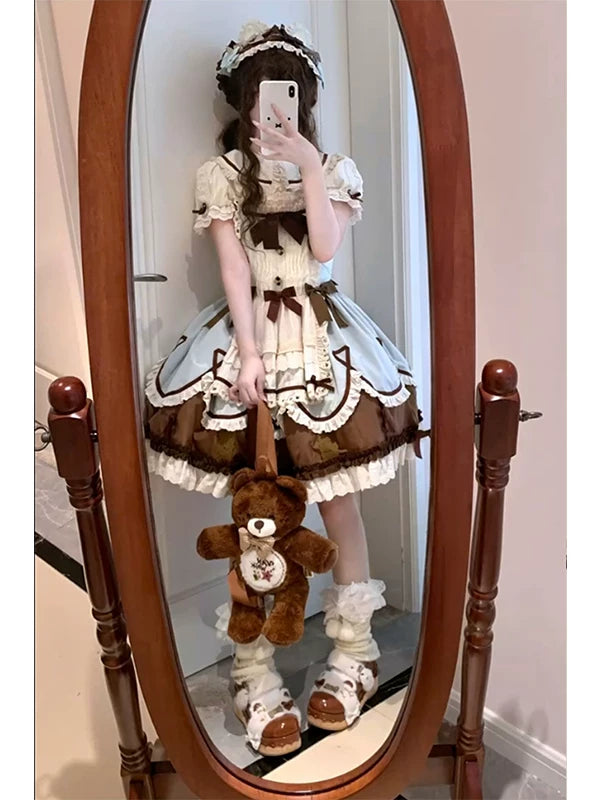 Mint Lolita JSK set with cape and ruffled inner layer shown in mirror photos.