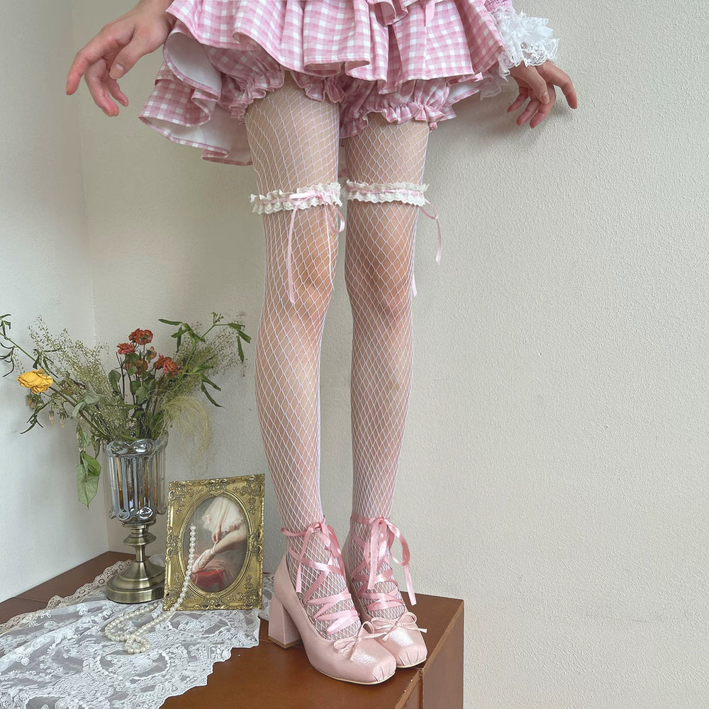 Blue-trimmed fishnet tights with lace bands and ribbon bows styled beneath a gingham skirt