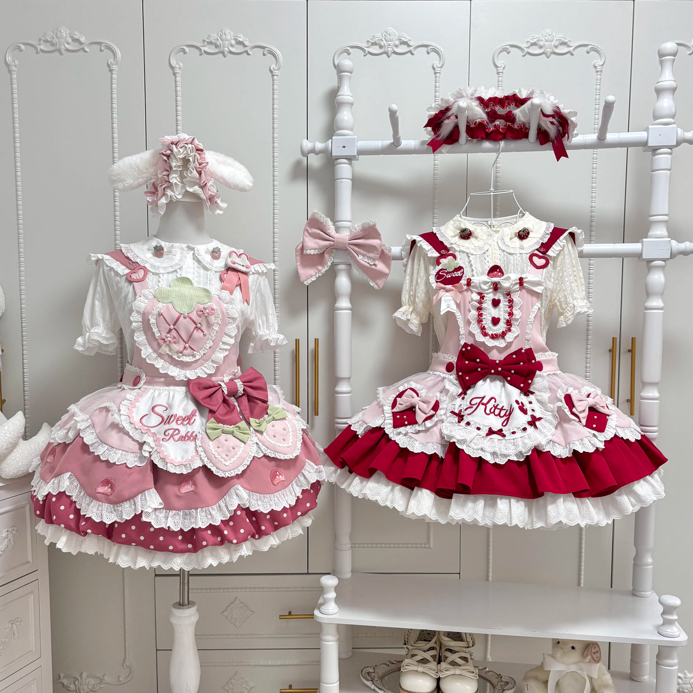 Pink and red Strawberry Bunny and Strawberry Cat JSK dresses with layered ruffles and bows
