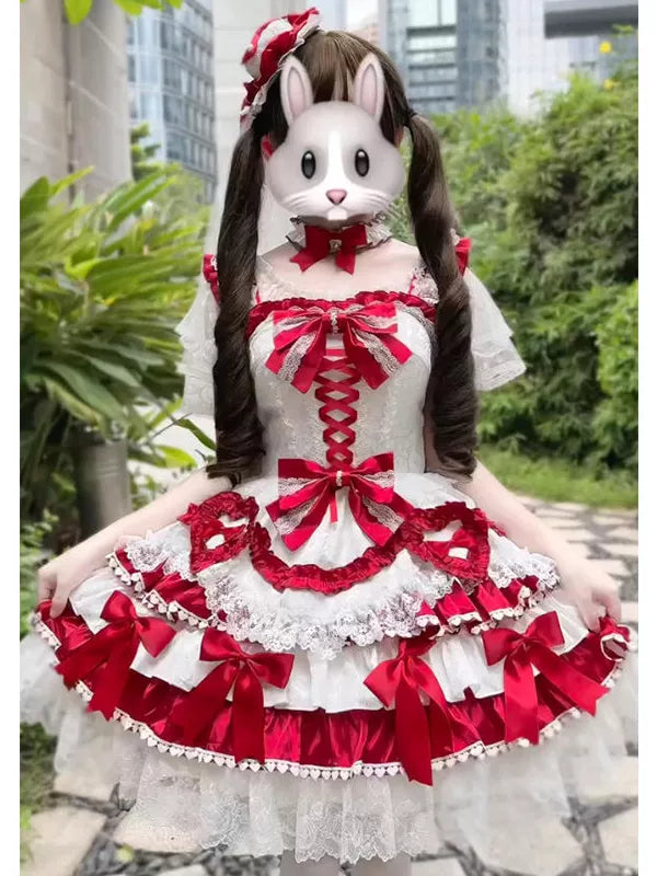 Red-and-white layered Lolita skirt set with bows and lace trim worn outdoors