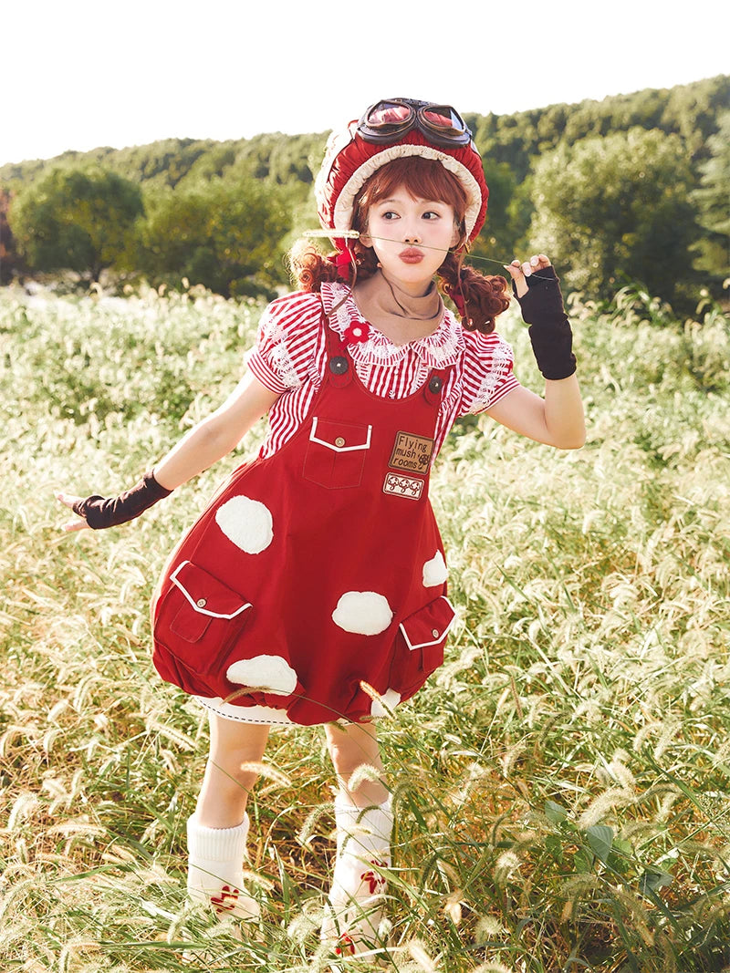Front view of a red Flying Mushroom JSK with white appliqué patches and pocket details.