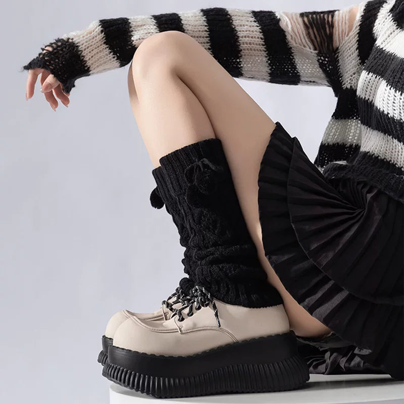 Black and coffee brown slouched knit leg warmers with pom-pom ties