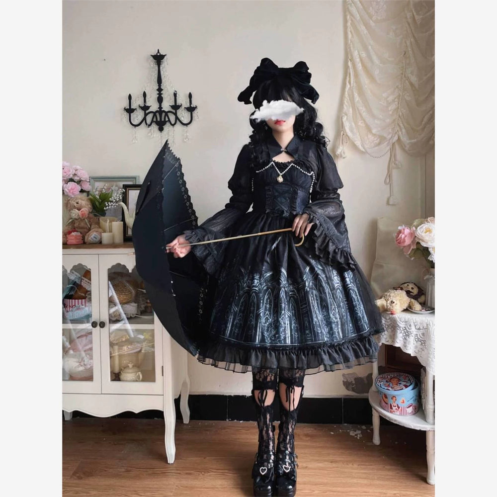 Black JSK dress with cathedral-arch print, pearl trim and layered ruffles