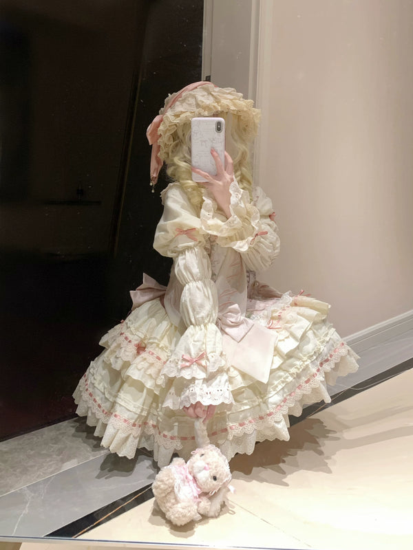 Mirror photos show natural-color and light-blue versions of the Daydream OP dress, detailed with layered lace ruffles and ribbon bows.
