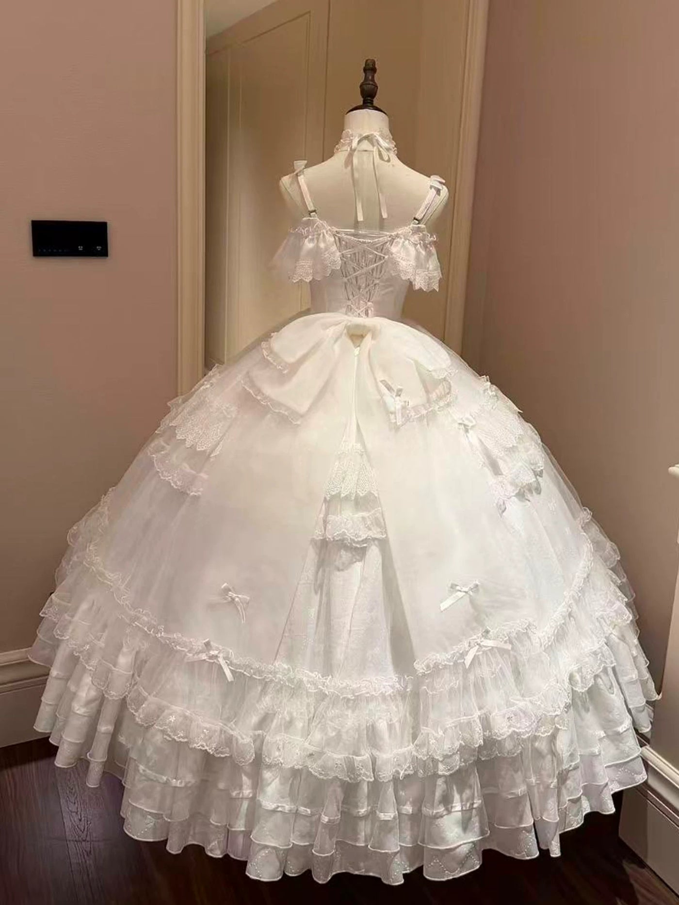 Emoji Dream apricot Lolita ballgown with off-the-shoulder neckline and bow details displayed on mannequin