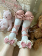 Chaussettes couleur ivoire avec nœuds roses vintage