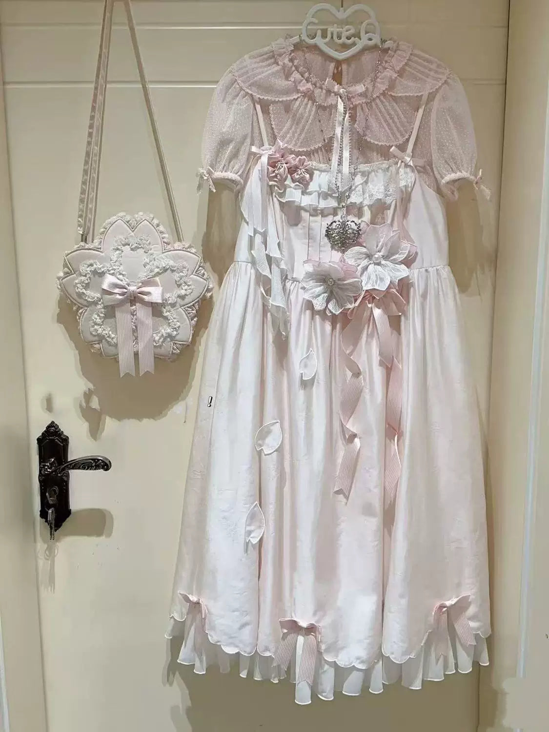 Pink and white sheer dotted-tulle inner layers with petal collars and lace trim
