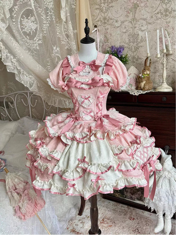 Pink and white ruffled OP dress with bows and a train on a mannequin