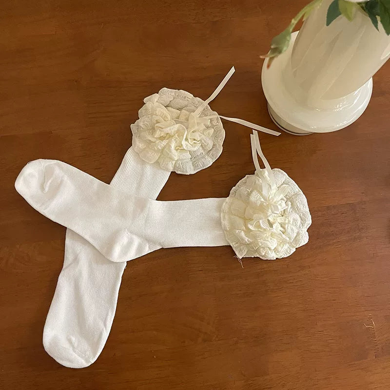 Sock Noble white ruffled slouch socks with ribbon ties