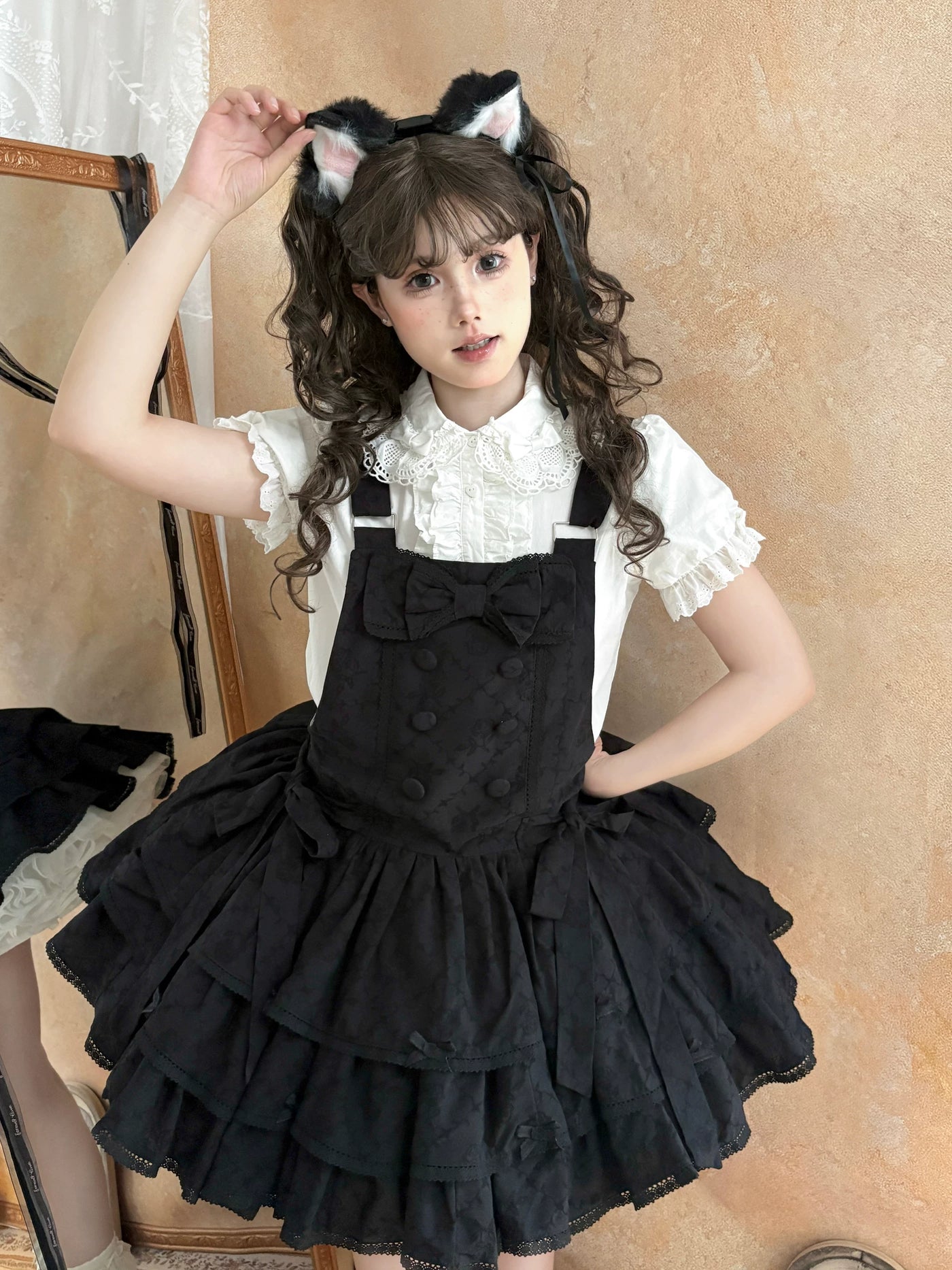 Black and white lolita JSK with cream lace trim between tiered skirt layers