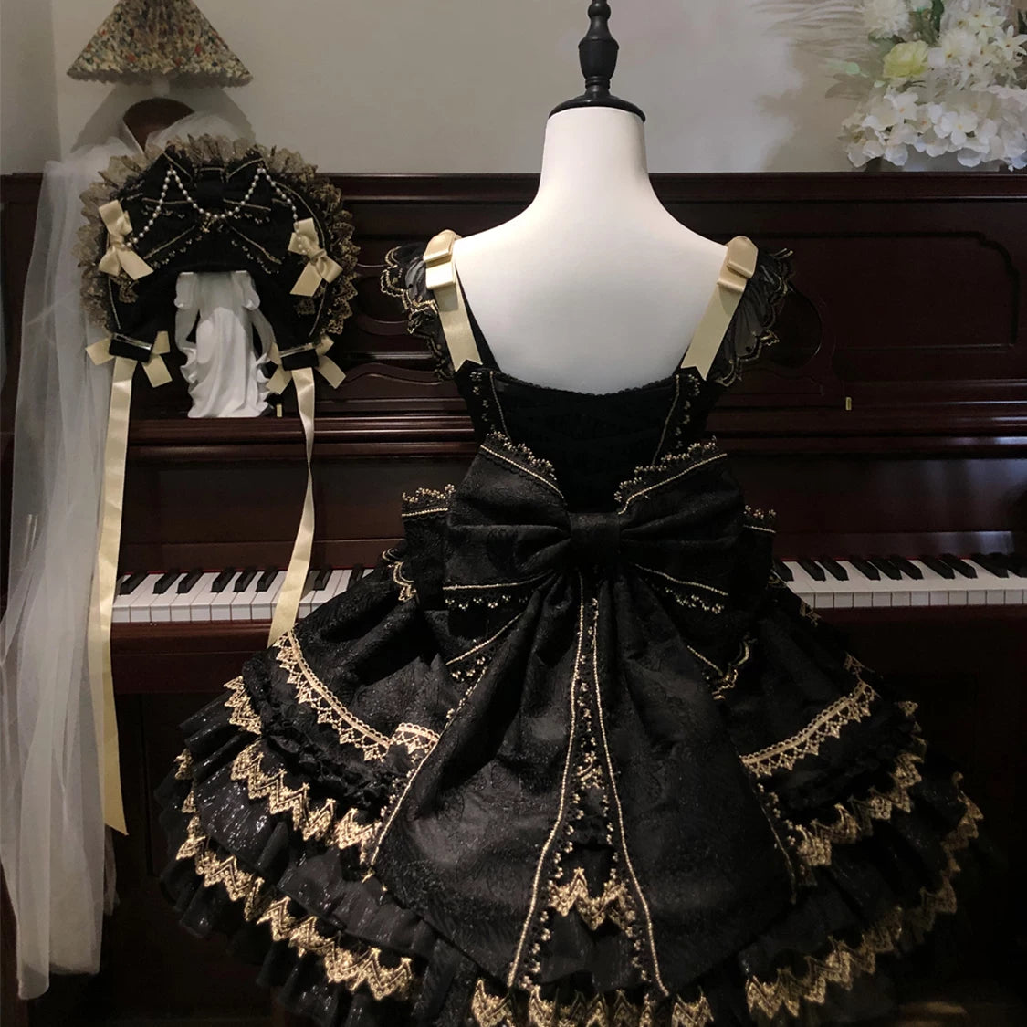 Lady Han Gilt Memory Lolita JSK dress featuring intricate gold detailing and an elegant original design, displayed on a hanger.