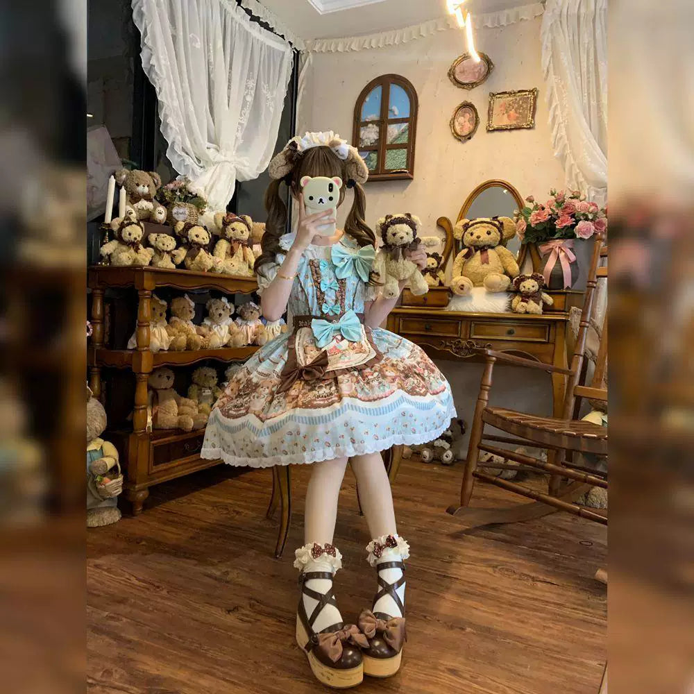 Mint JSK dress with illustrated print, chocolate-brown trim and blue accents