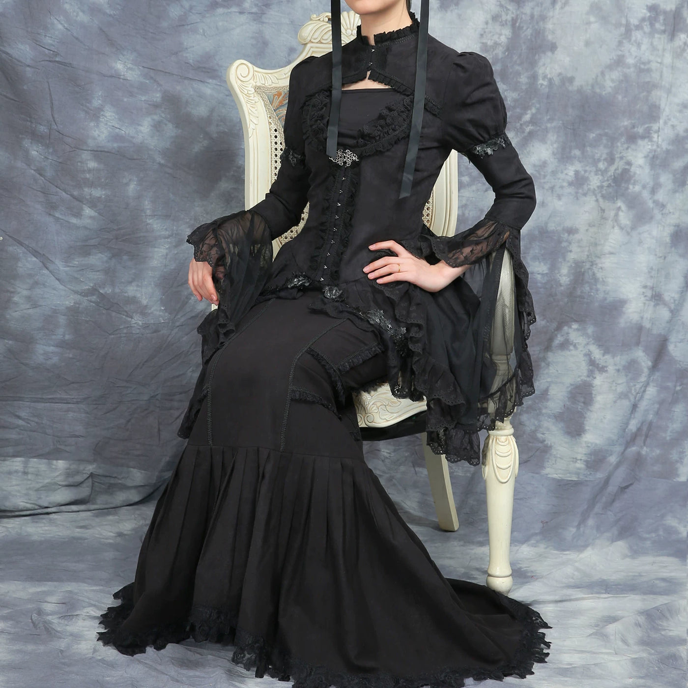 Black LACE GARDEN mesh outerwear and mermaid skirt styled on a seated model