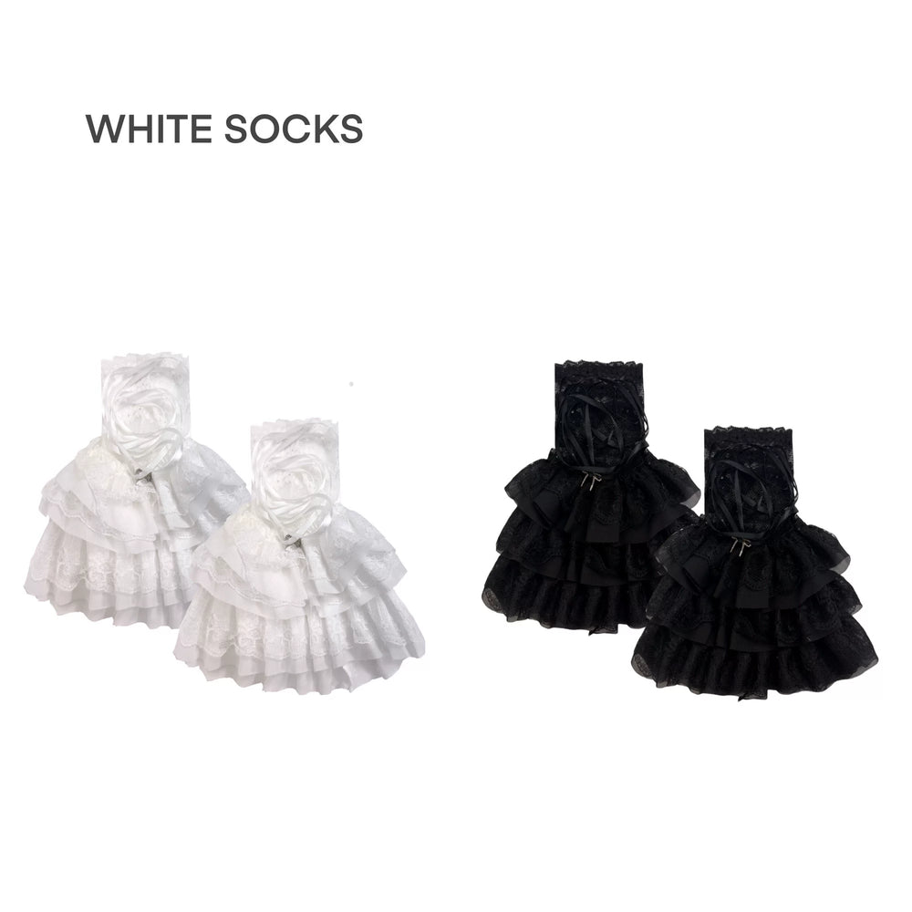White lace-trimmed leg sleeve with ribbon lacing and ruffled hem