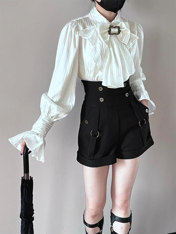 Model wearing a Creamy white blouse and black shorts set with a ruffled collar