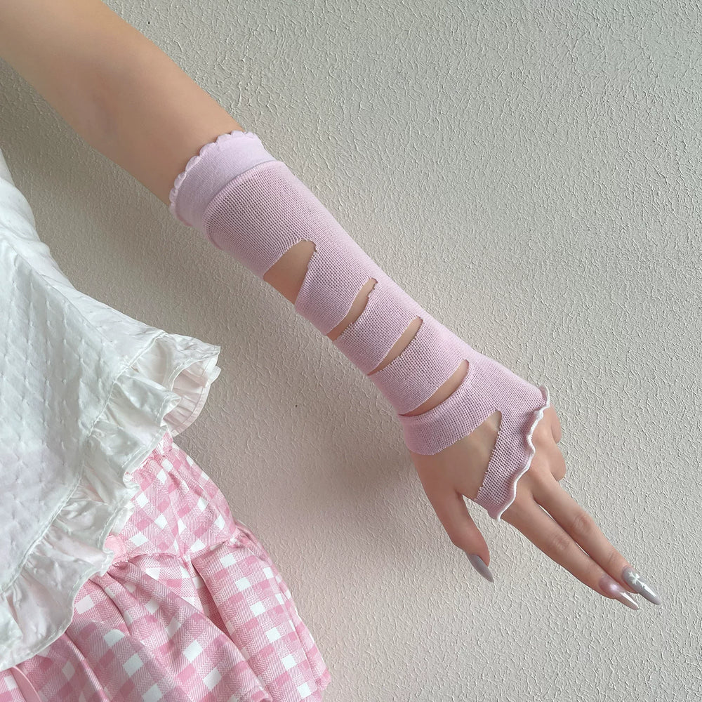 Pastel arm sleeve gloves with distressed cutout bands shown on a hand