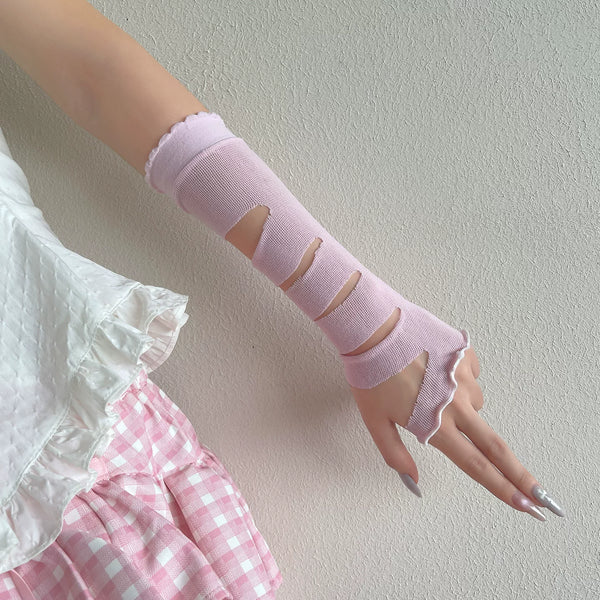 Pastel arm sleeve gloves with distressed cutout bands shown on a hand