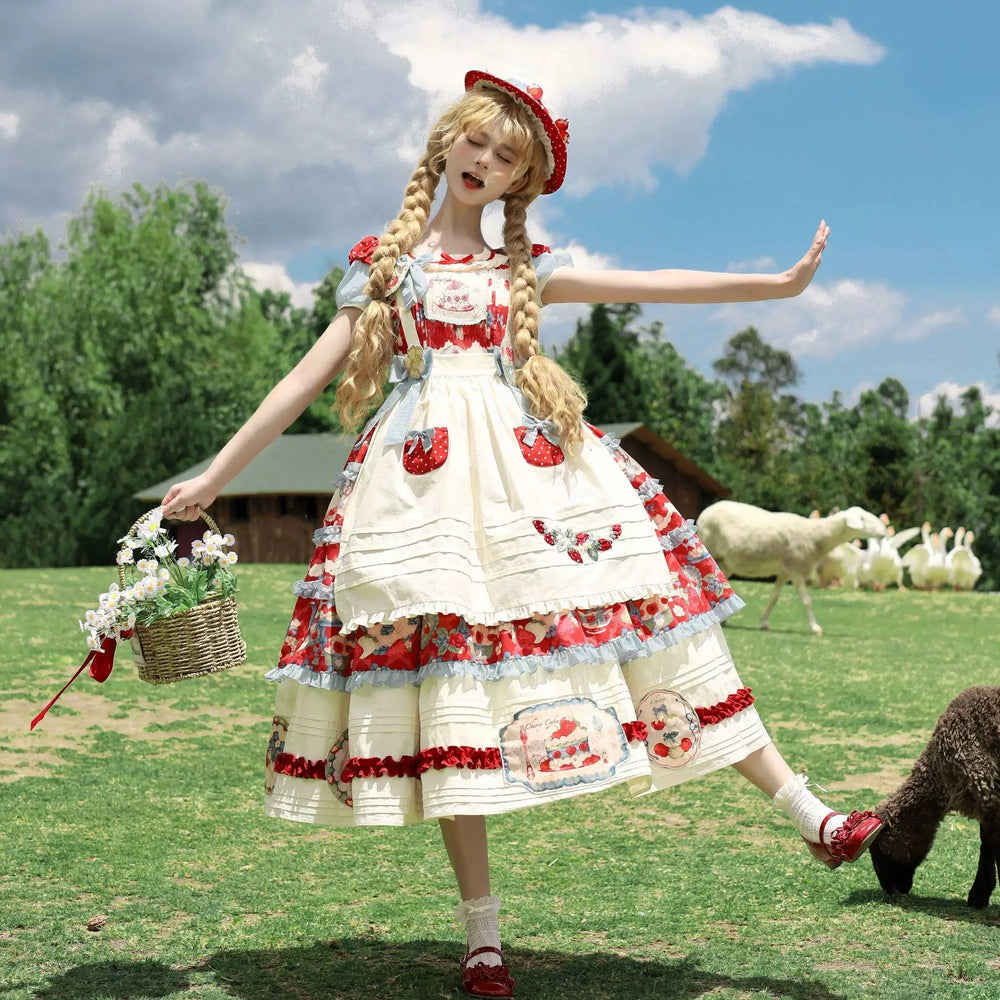 Strawberry print Lolita dress with apron, ruffles, and pale blue trim