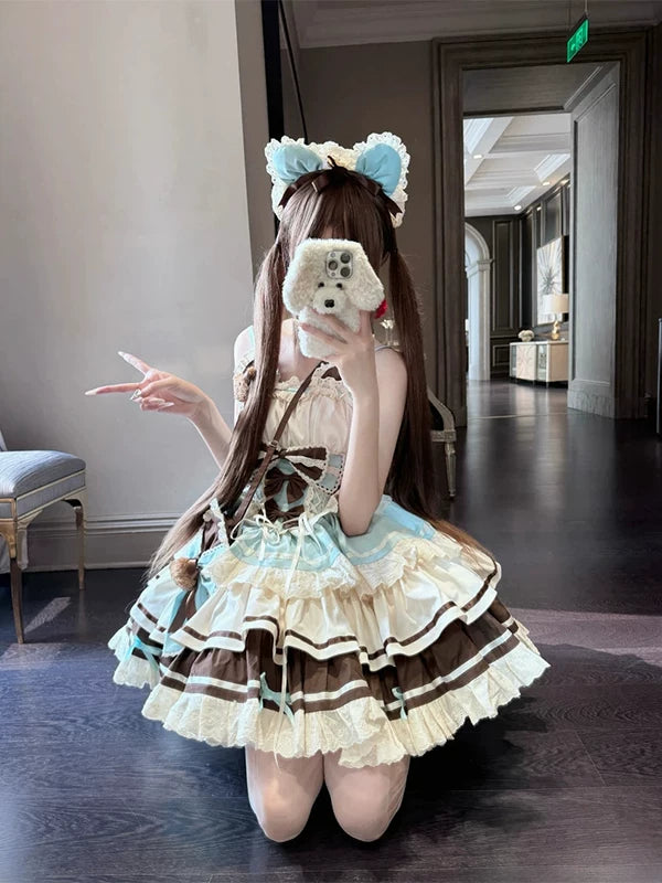 Model wearing a chocolate-and-cream Lolita skirt set with a crossbody bag and blue-bow headband.