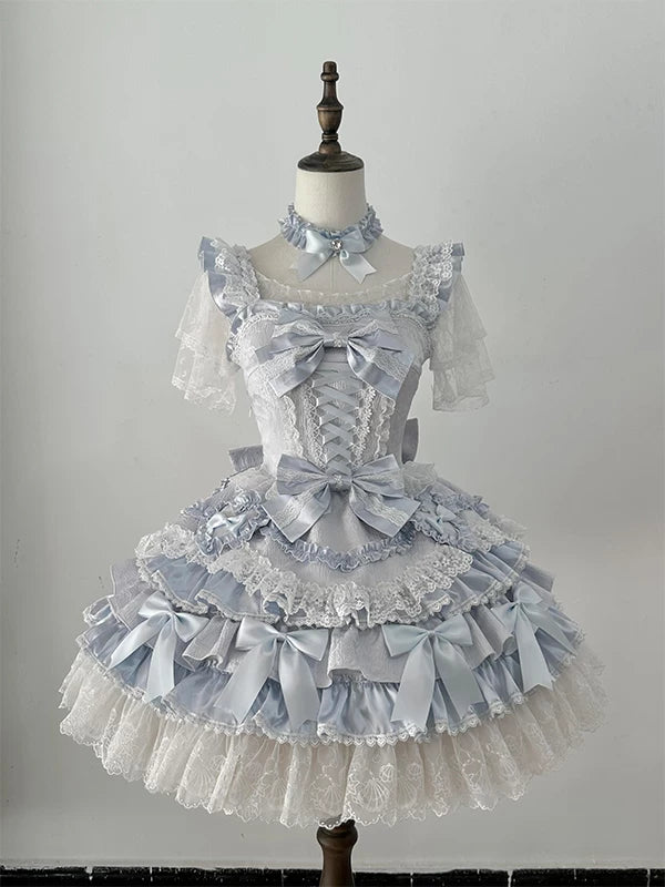 Pale blue Creamy Lolita dress on a mannequin with lace trims, bows and a tiered skirt