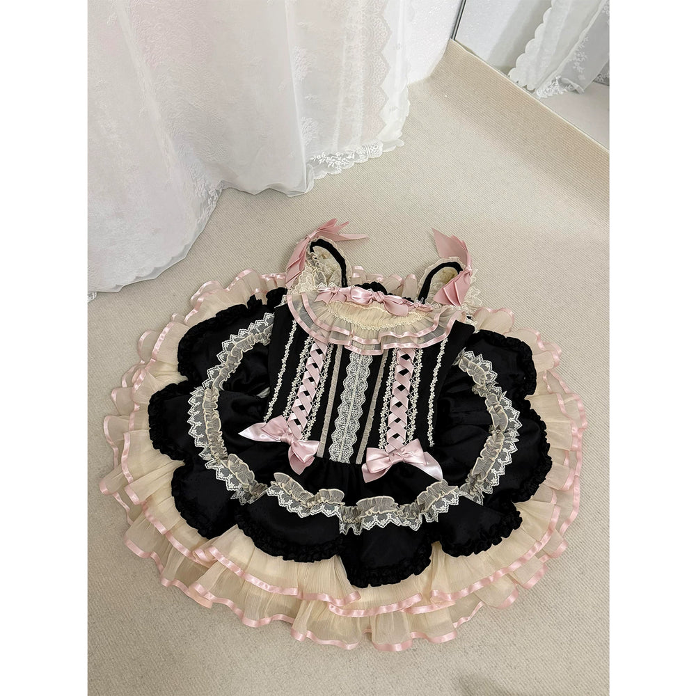 Creamy black and pink ruffle JSK dress with bows shown in a mirror selfie