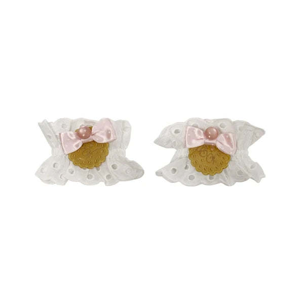 White lace hair accessories with pink bows and gold-toned medallion details
