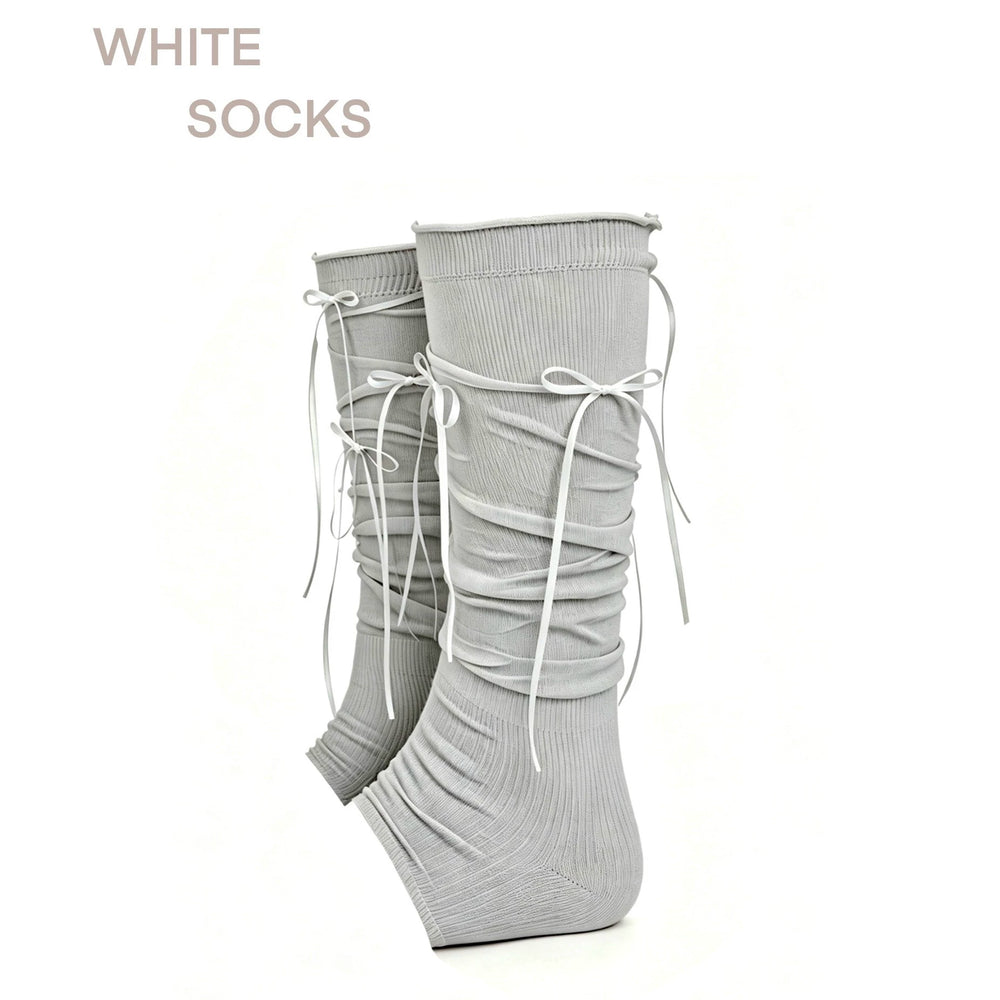 Footless gray scrunch leg warmers with ribbon bows shown as a pair