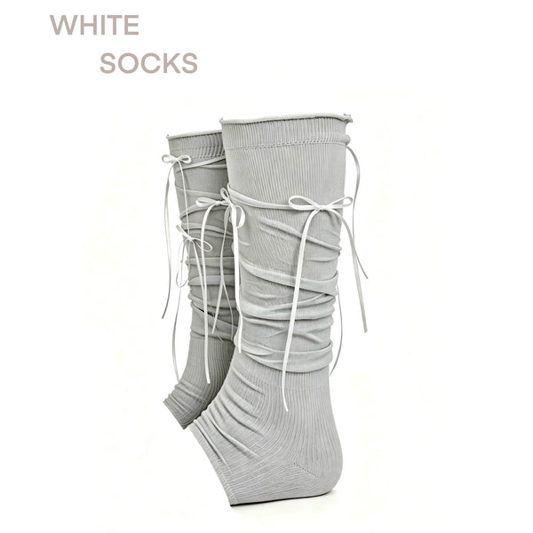 Footless gray scrunch leg warmers with ribbon bows shown as a pair