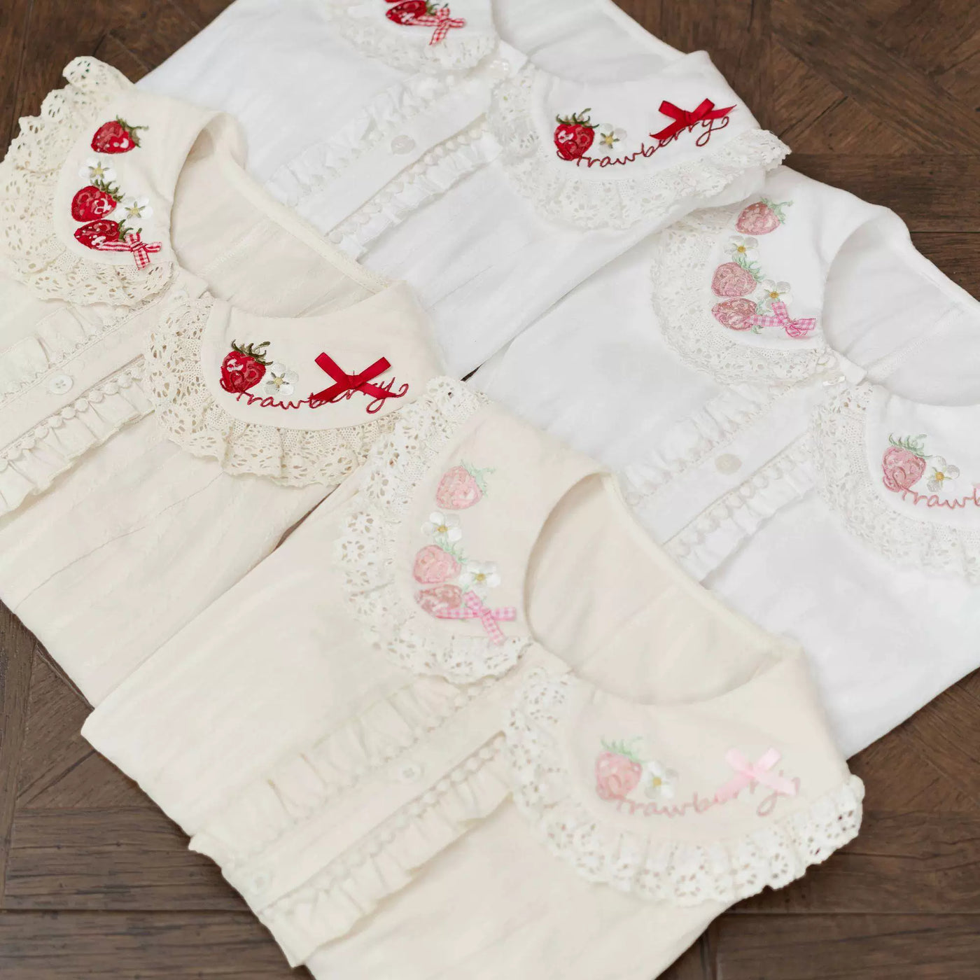 White short-sleeve blouse with strawberry and flower embroidery