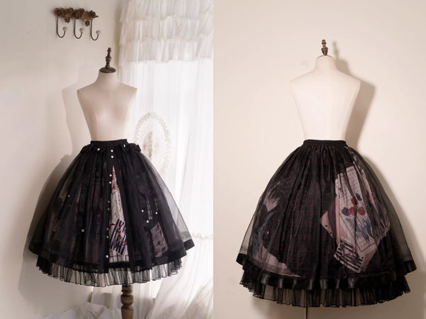 Model wearing black printed Lolita styling with a tulle-layered skirt