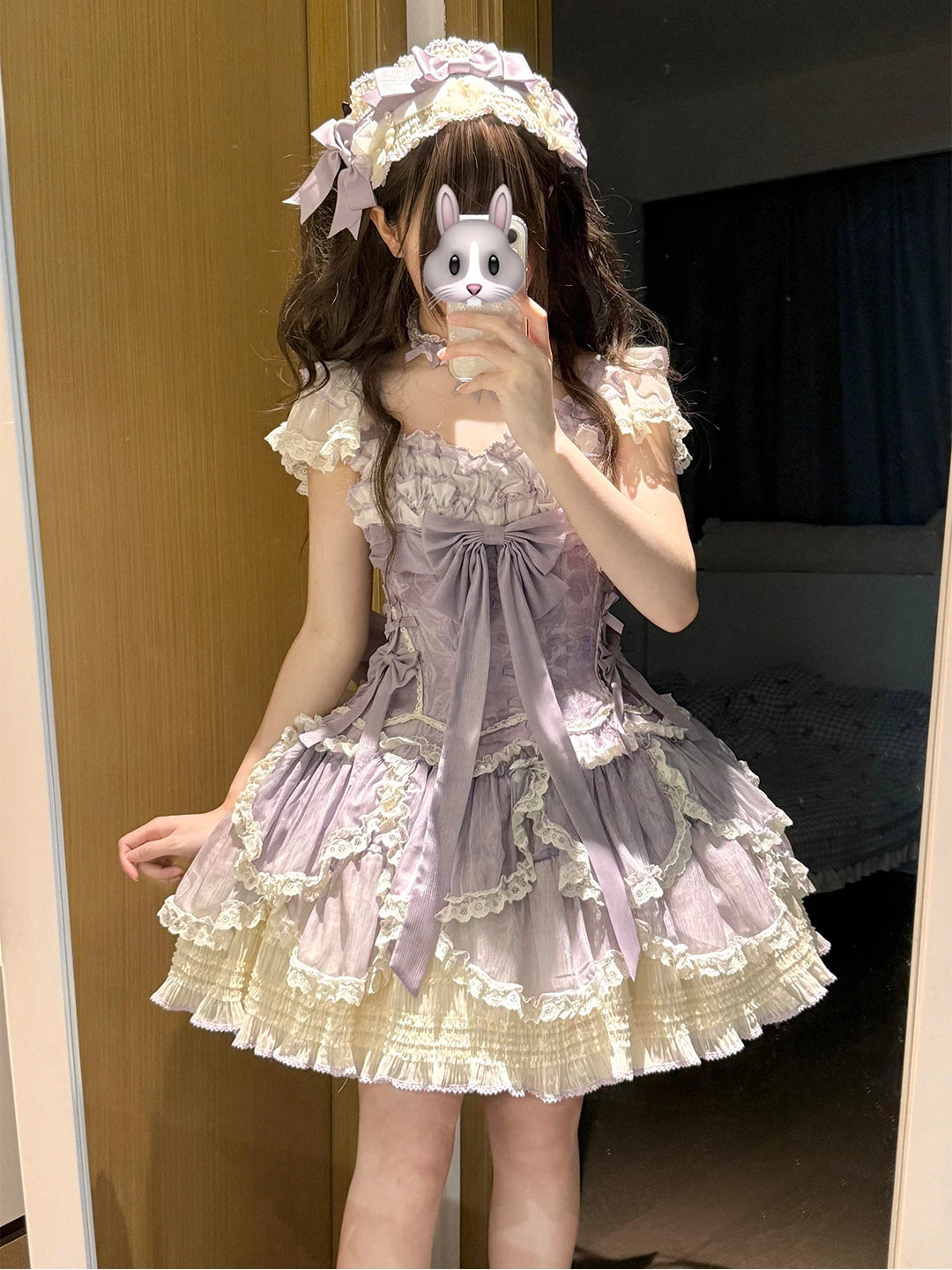 Purple Creamy Lolita dress with layered lace, a large bow and a full skirt