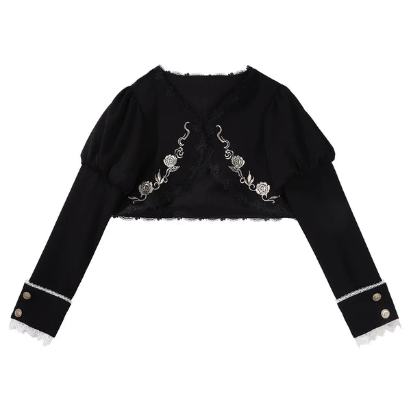 Black embroidered bolero and white long-sleeve blouse with black bow from a Gothic Lolita dress set