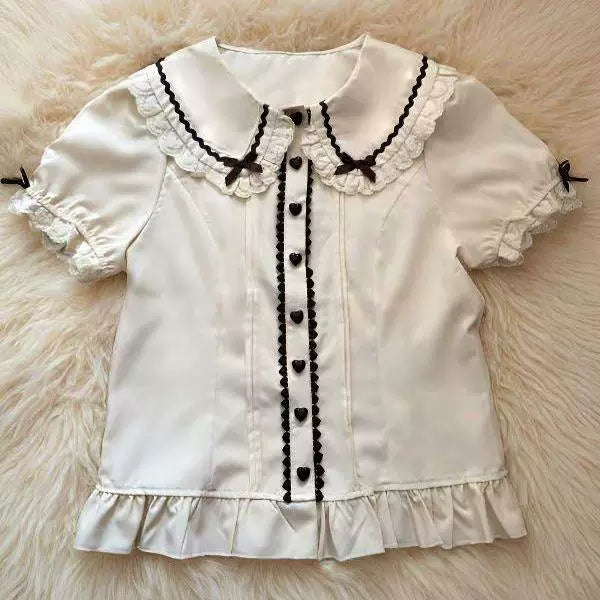 Natural beige long-sleeve Sweet Lolita blouse with lace-trimmed Peter Pan collar and ribbon bows