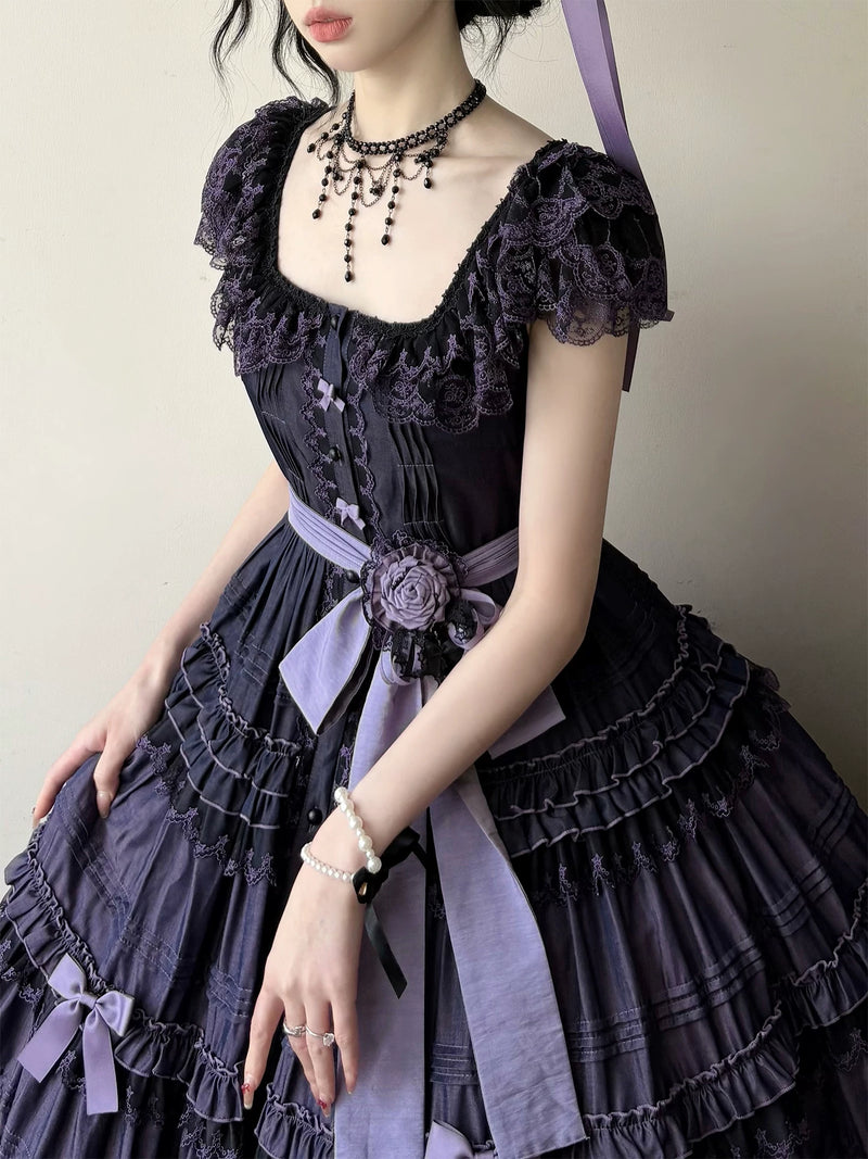 Model wearing the JSK with satin sash and fabric rose waist appliqué